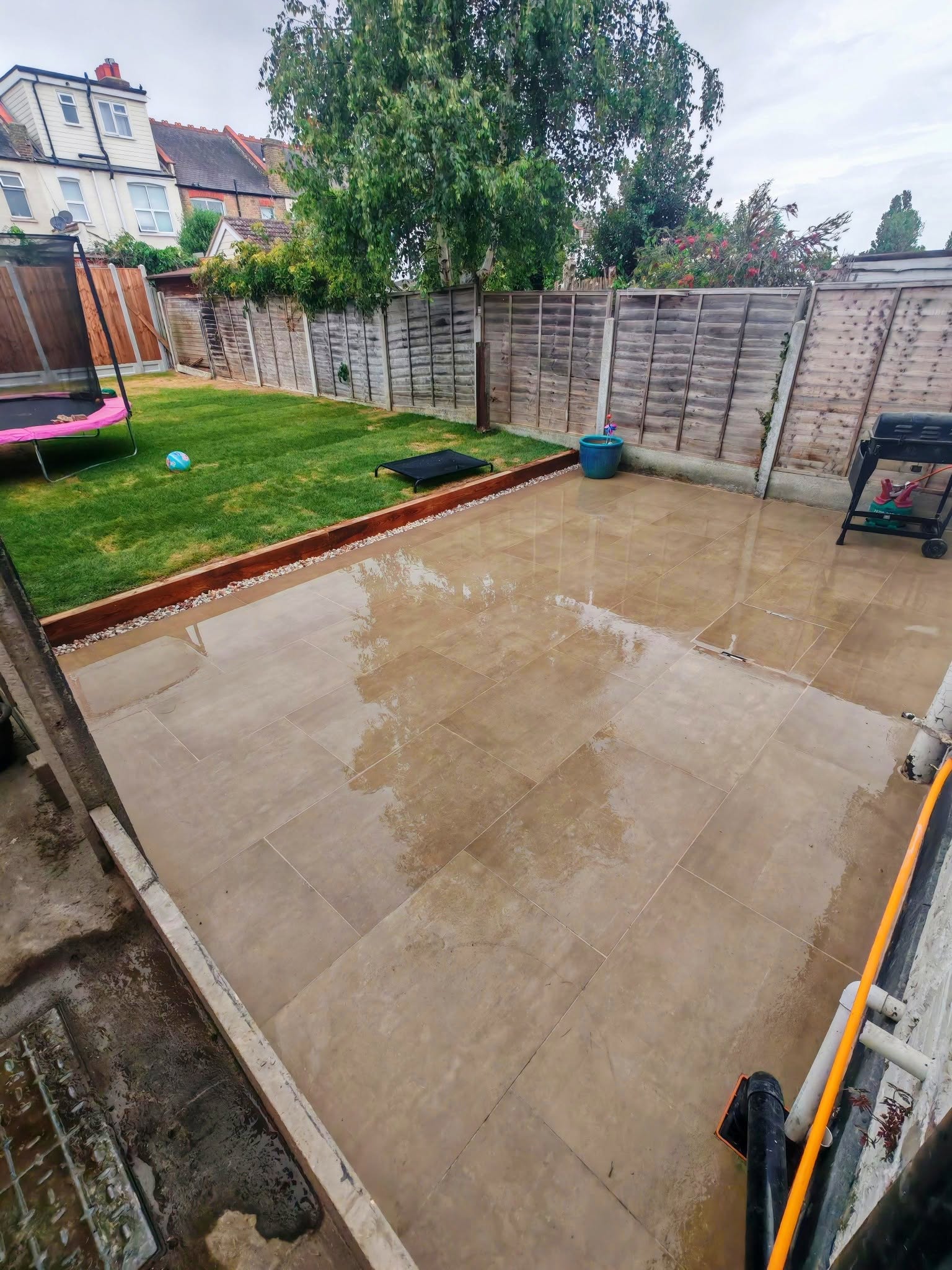 Modern timber slatted garden fencing installation