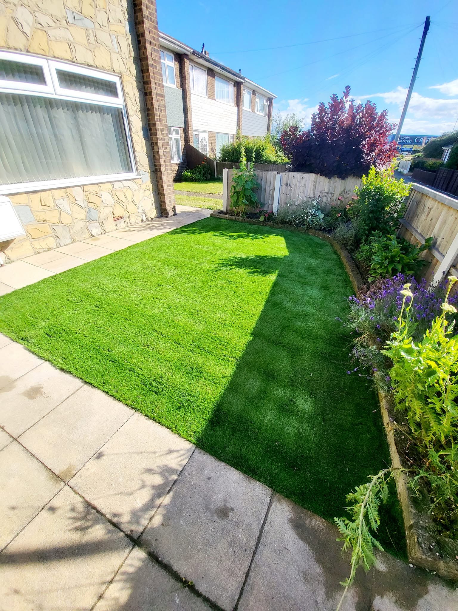 Front garden landscaping with block paving and curved edging