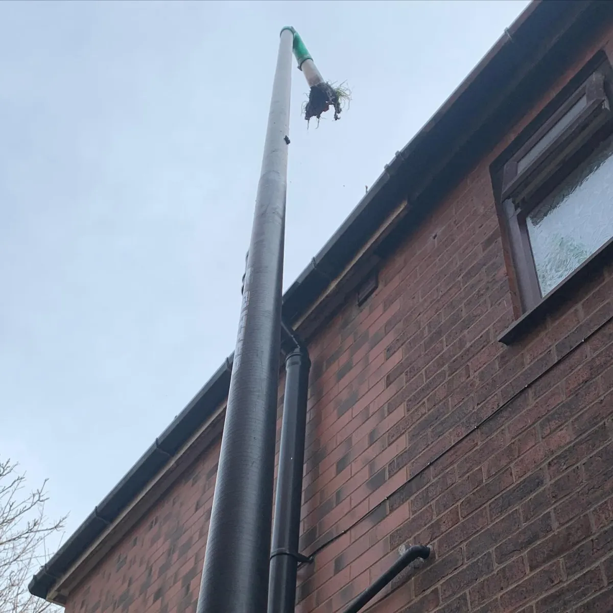 Debris being removed from gutters 