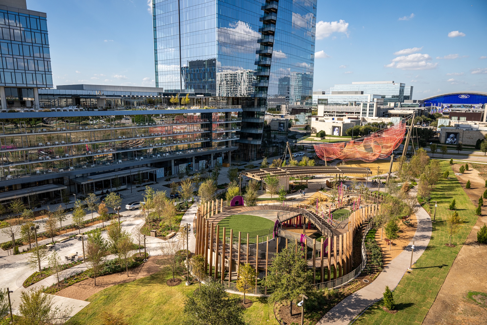 Modern Frisco, Texas architecture with softly blurred buildings and warm natural lighting.