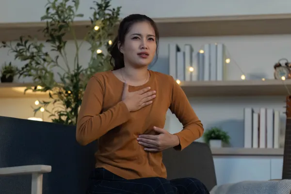 a group of people standing on top of a lush green field