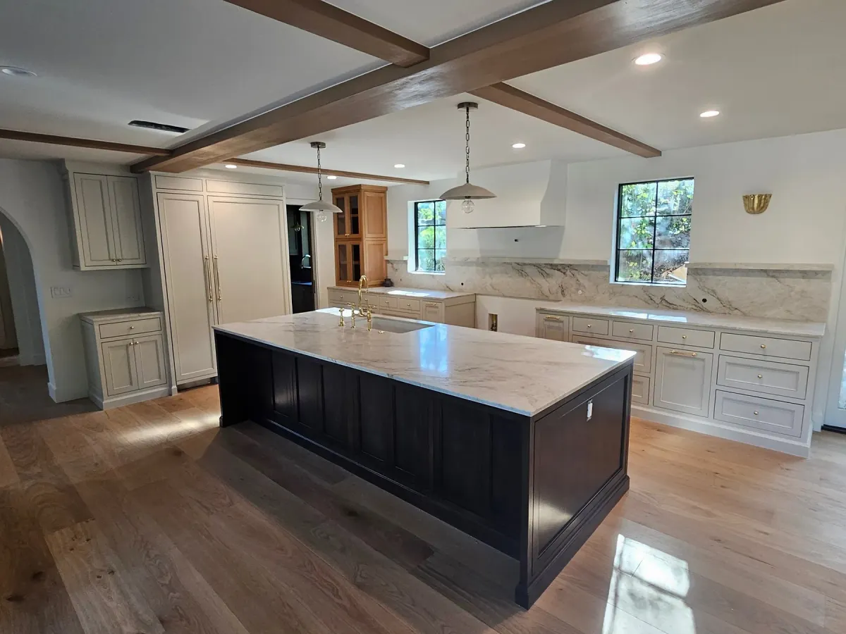 Dark kitchen island with custom cabinetry
