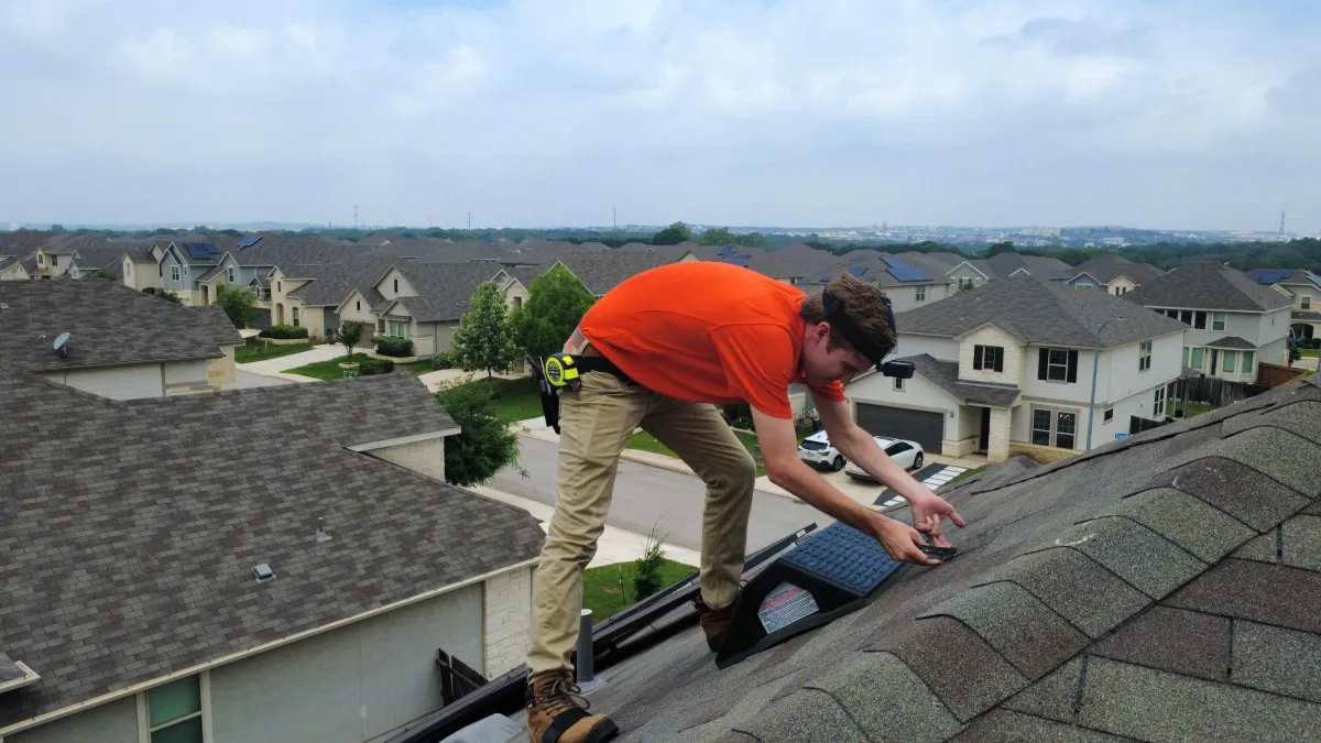 Roof Inspetor examining roof for storm damage