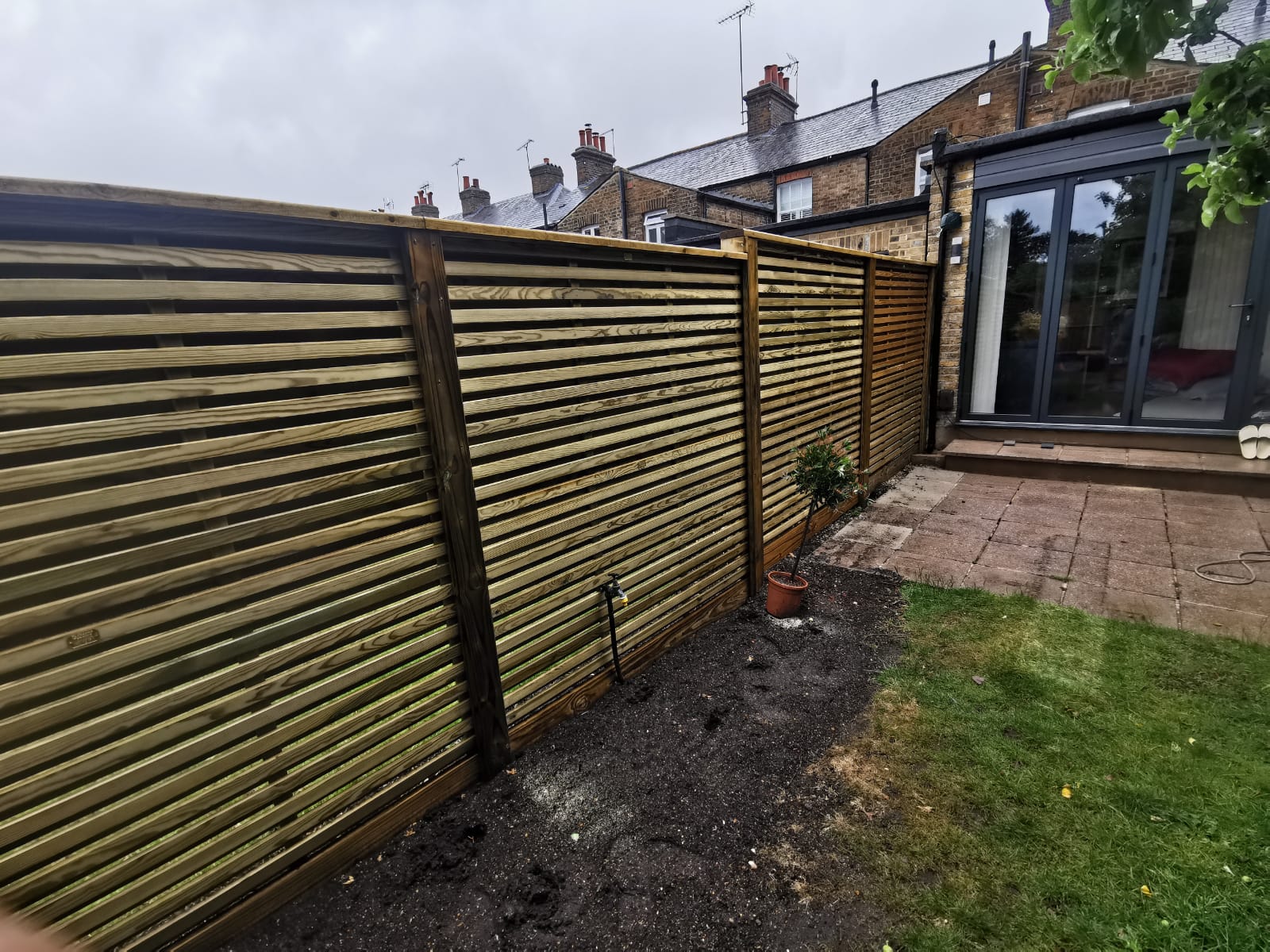 Venetion slatted fencing installation for a modern garden in Bicester