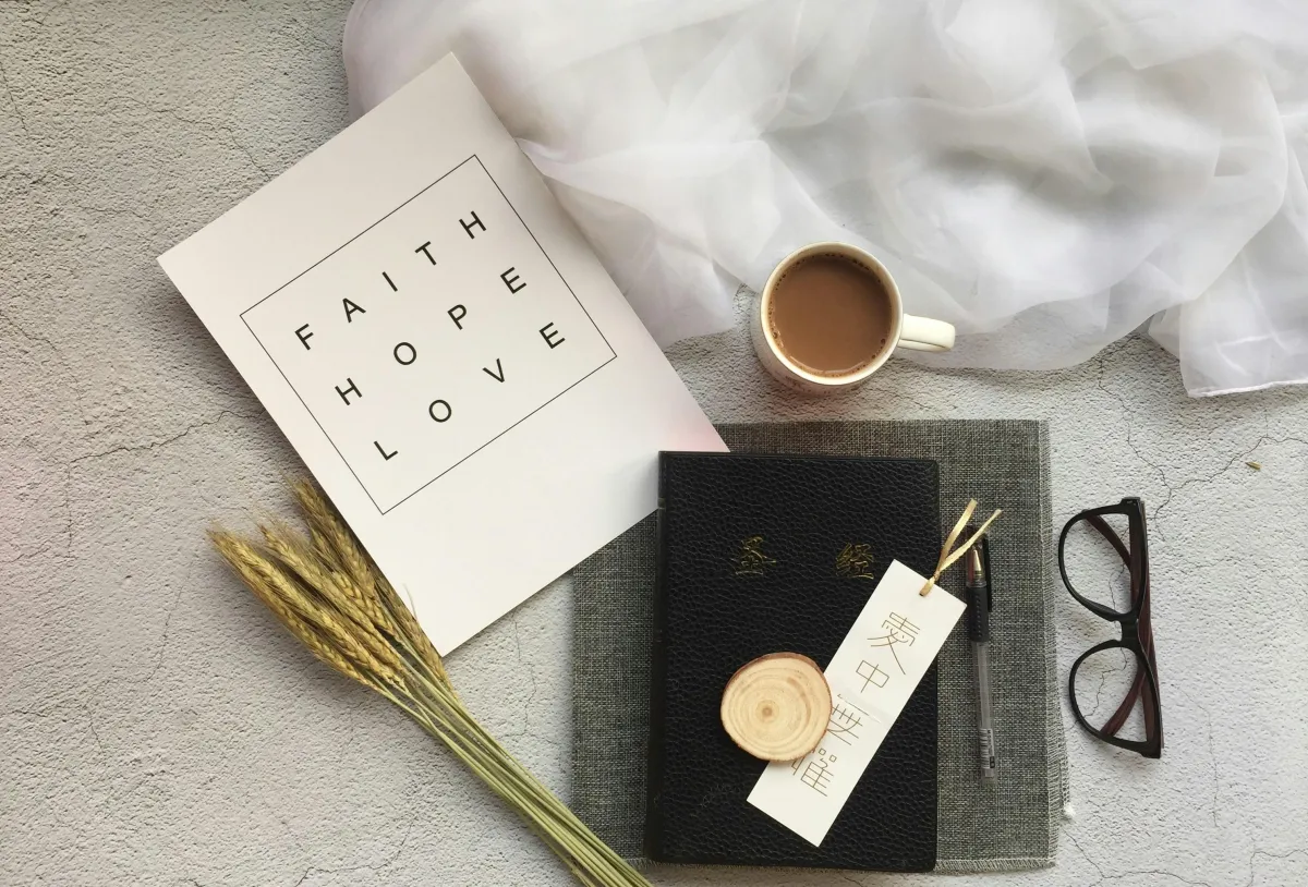 bible, journal, coffee, glasses, set up to remind us to live intentionally for God.