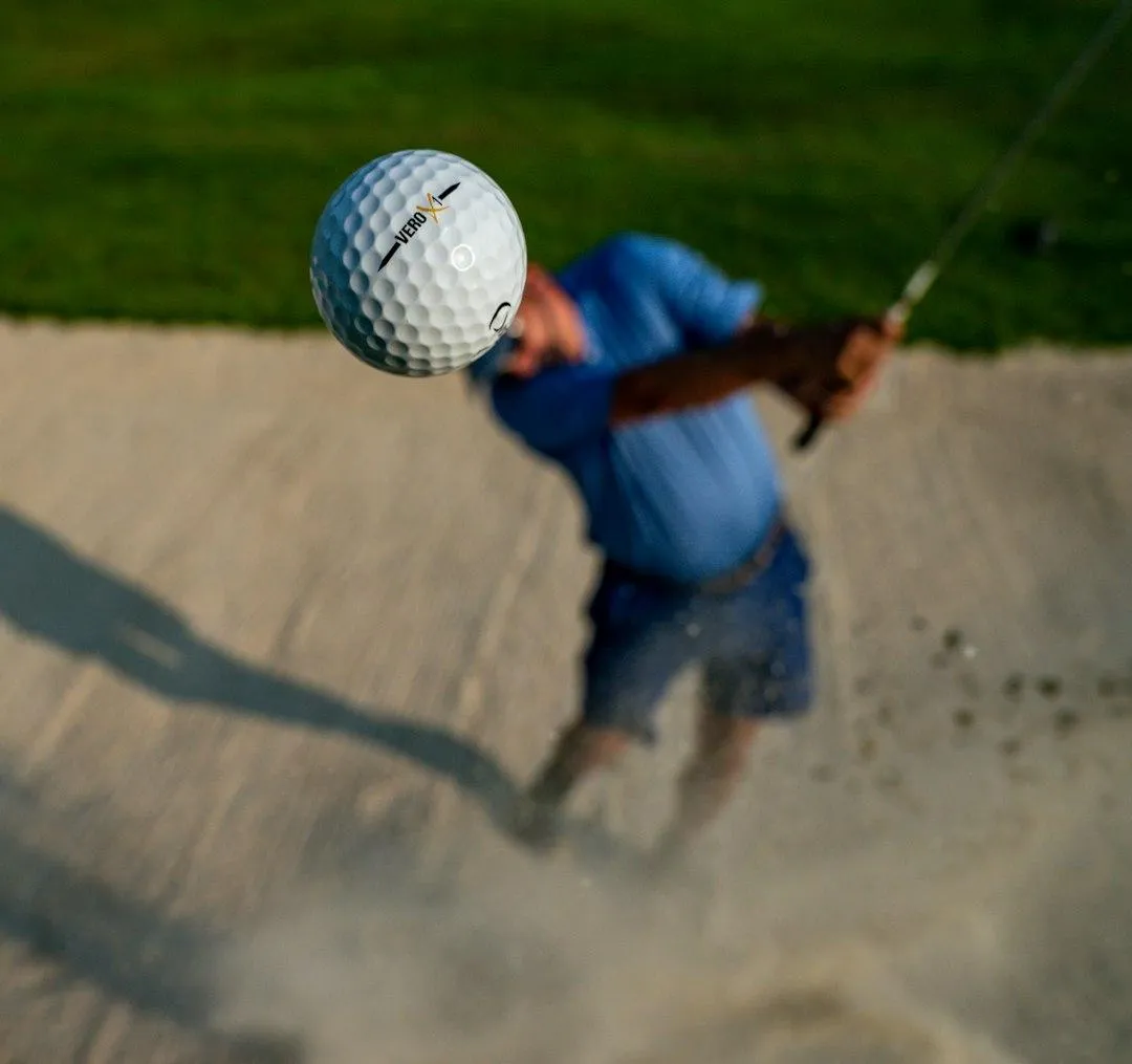 man playing golf under blue sky during daytime