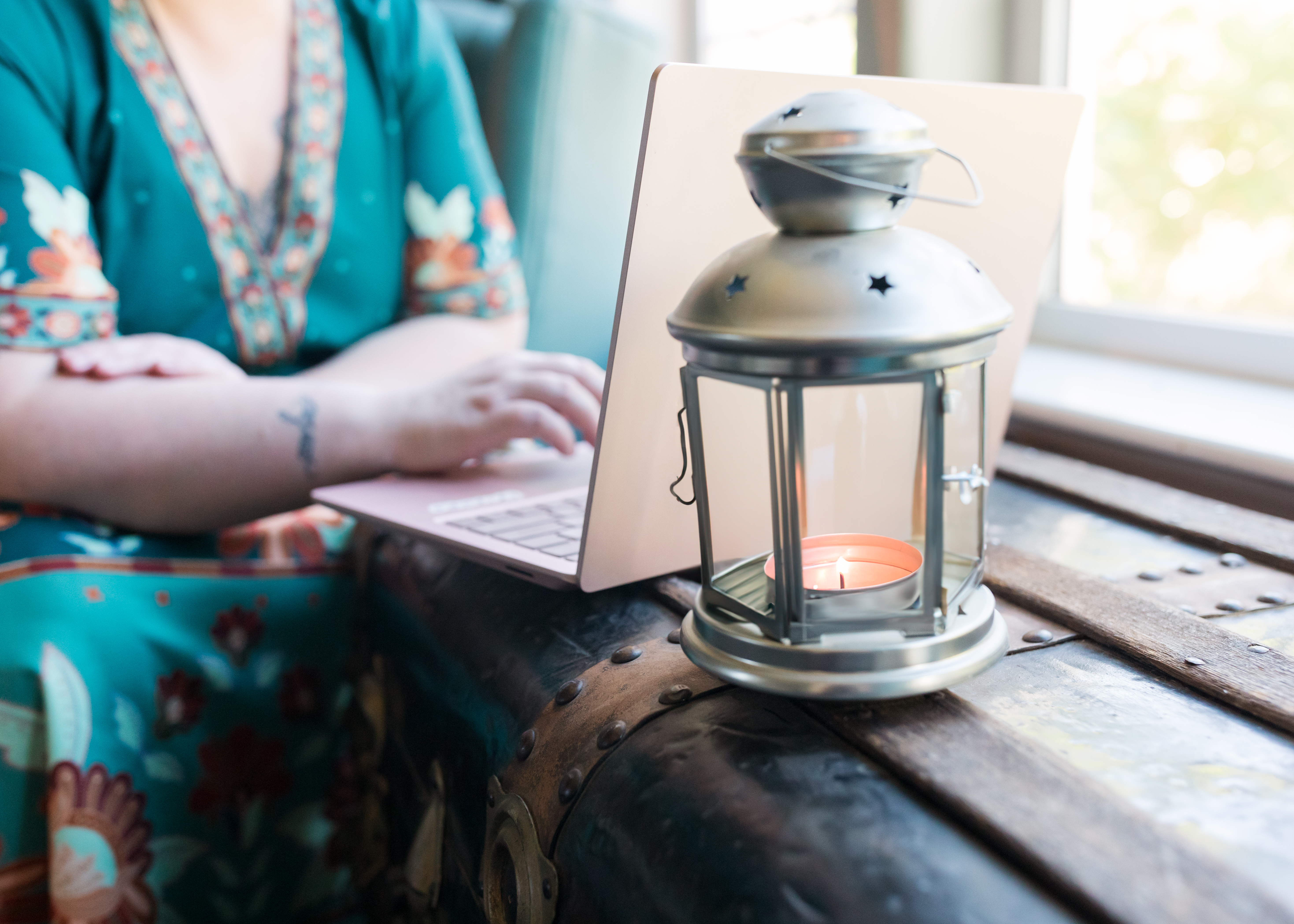Elaine Turso with laptop and lantern