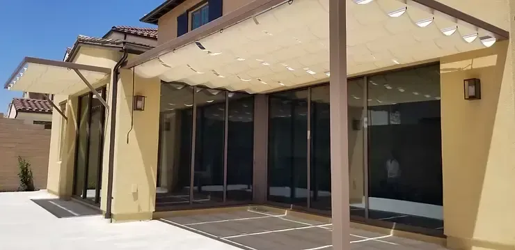 Modern white retractable patio awning installation next to a residential pool in Laguna Niguel, CA
