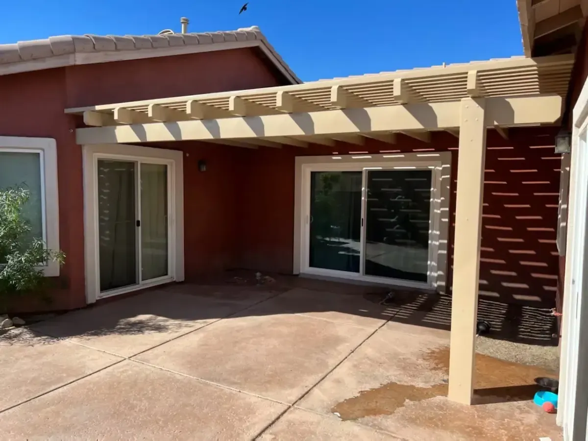 Beige patio cover structure attached to a terracotta stucco home in Tustin, CA