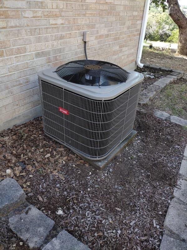 a air conditioner outside of a brick building