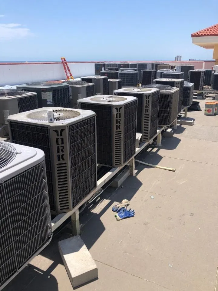 a group of air conditioning units on a roof