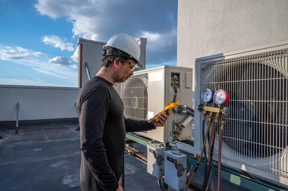 HVAC expert wearing a hard hat and glasses