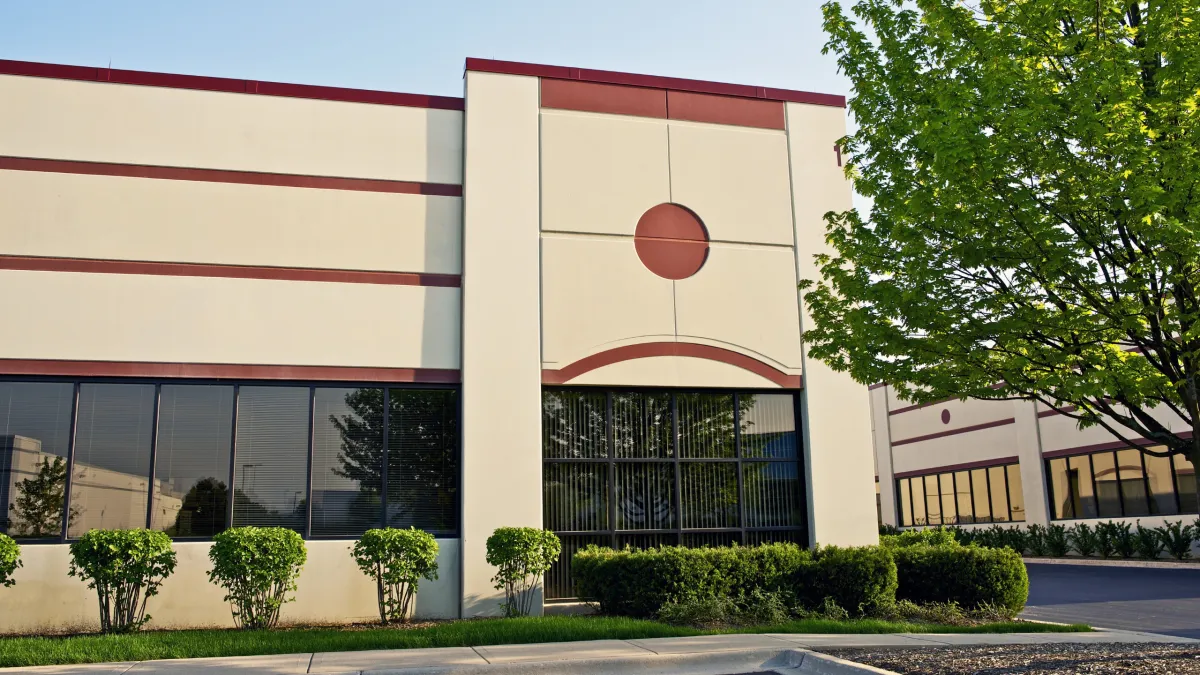 Professional commercial painting for warehouses, schools, and multi-unit buildings by By Hand Painting
