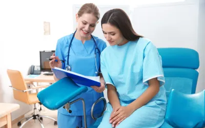 Female patient and doctor reviewing fertility ultrasound results.