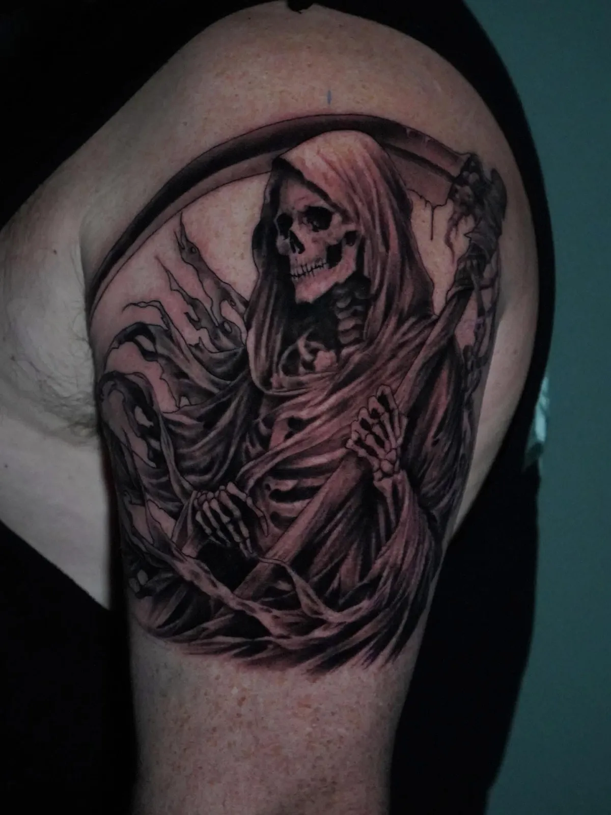 person in blue denim shorts and white nike sneakers standing on gray concrete floor