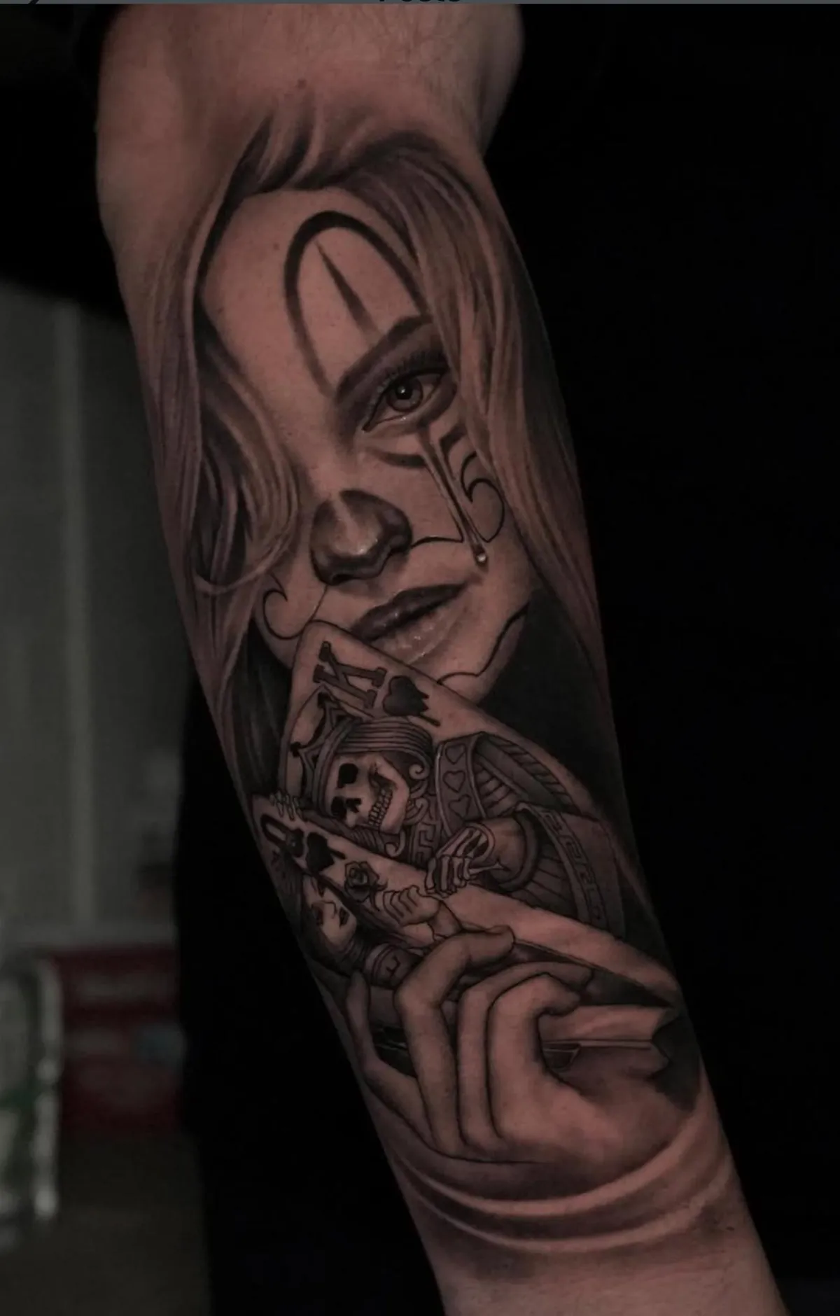 person with tattoo on right arm