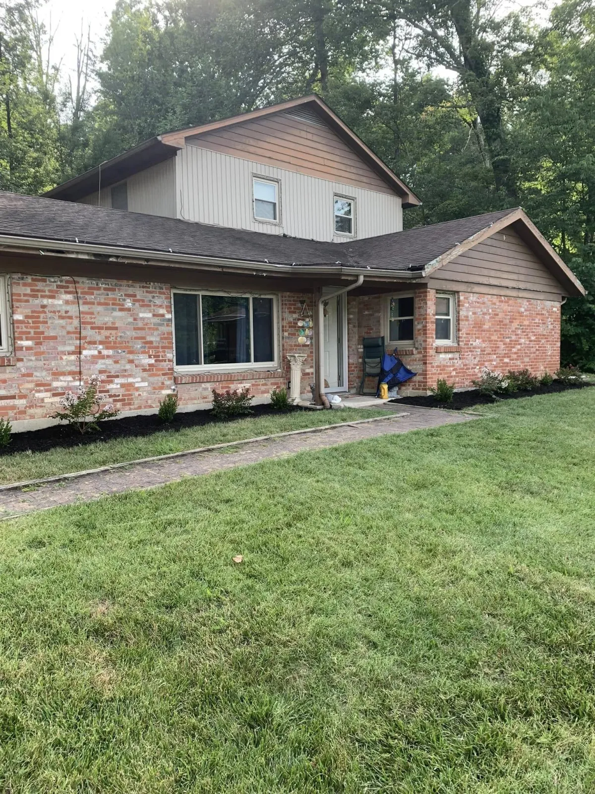 green grass field with brown wooden fence