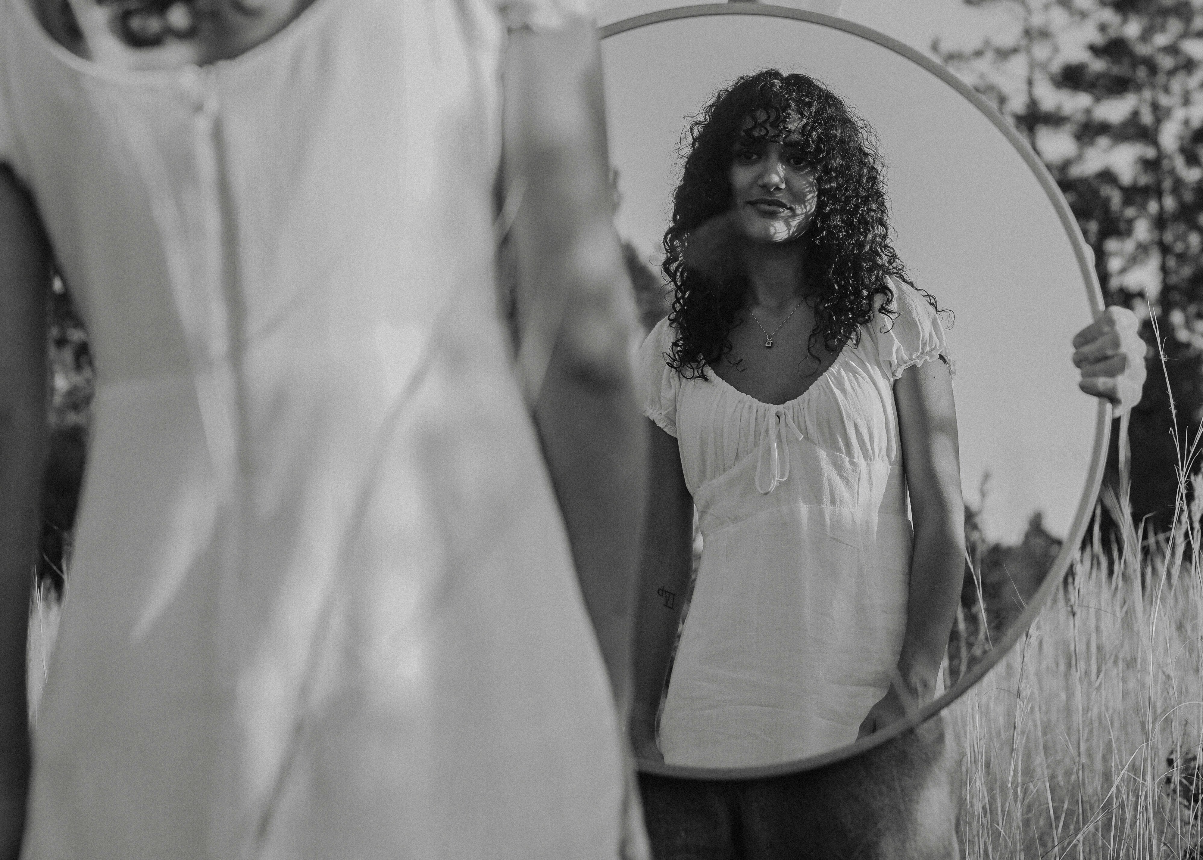woman looking at reflection