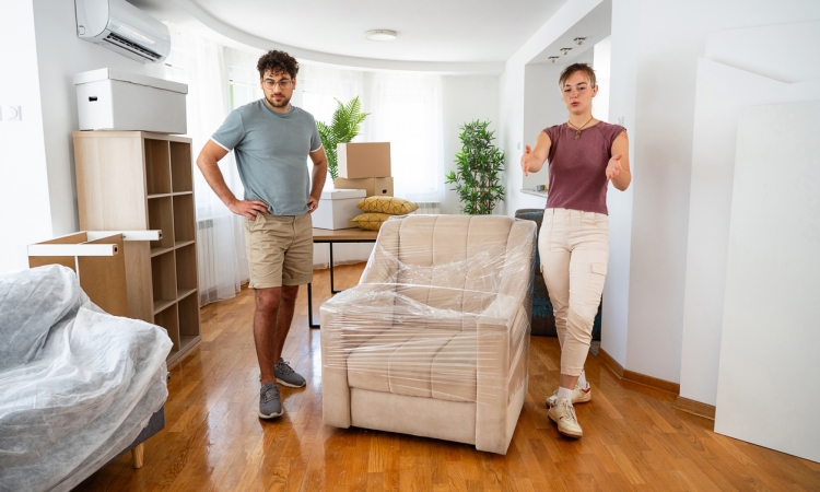 White-glove moving services featuring stretch-wrapped furniture and organized room staging