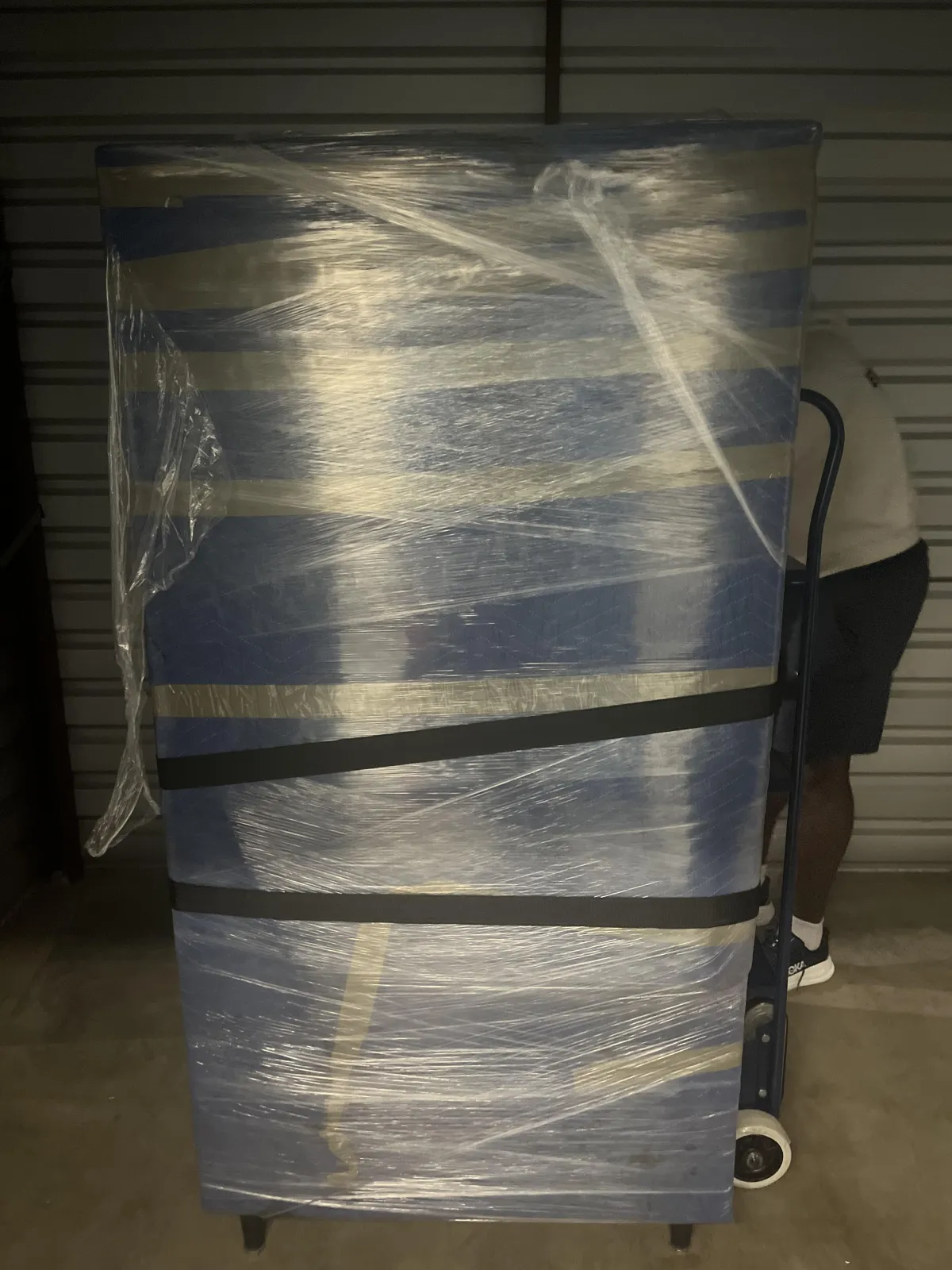 Boxes stacked in a moving van, with a view of a residential area outside, emphasizing moving services offered by Keep It Moving Services in Union City, NJ.