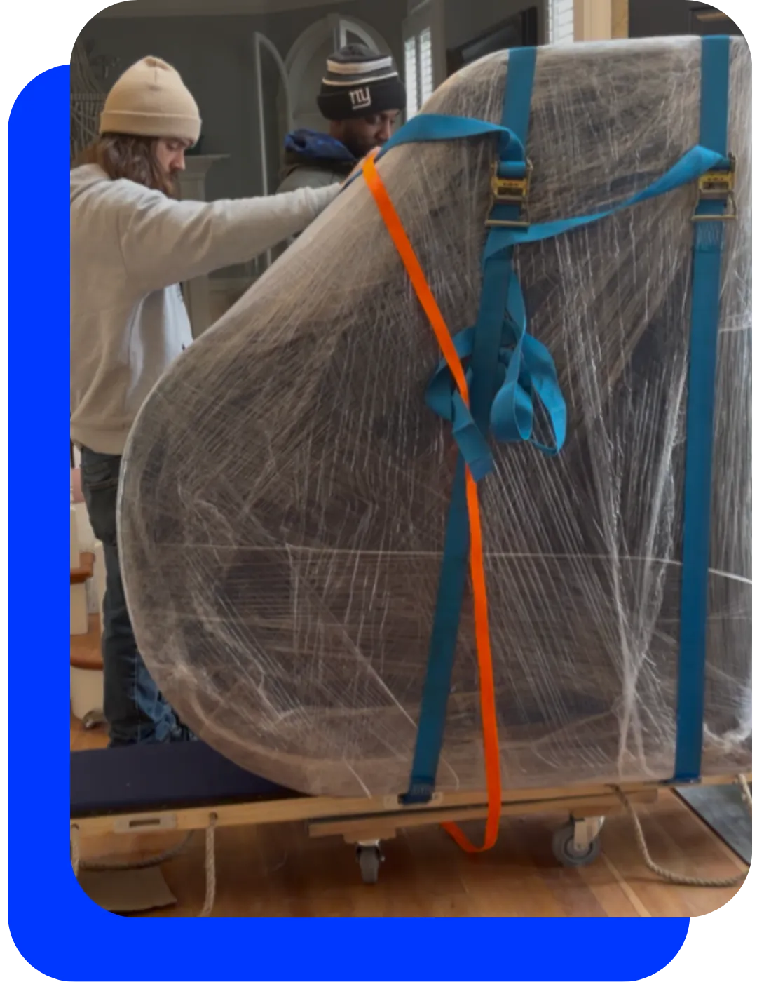 Professional piano moving services using specialized equipment and protective wrapping for safe transportation