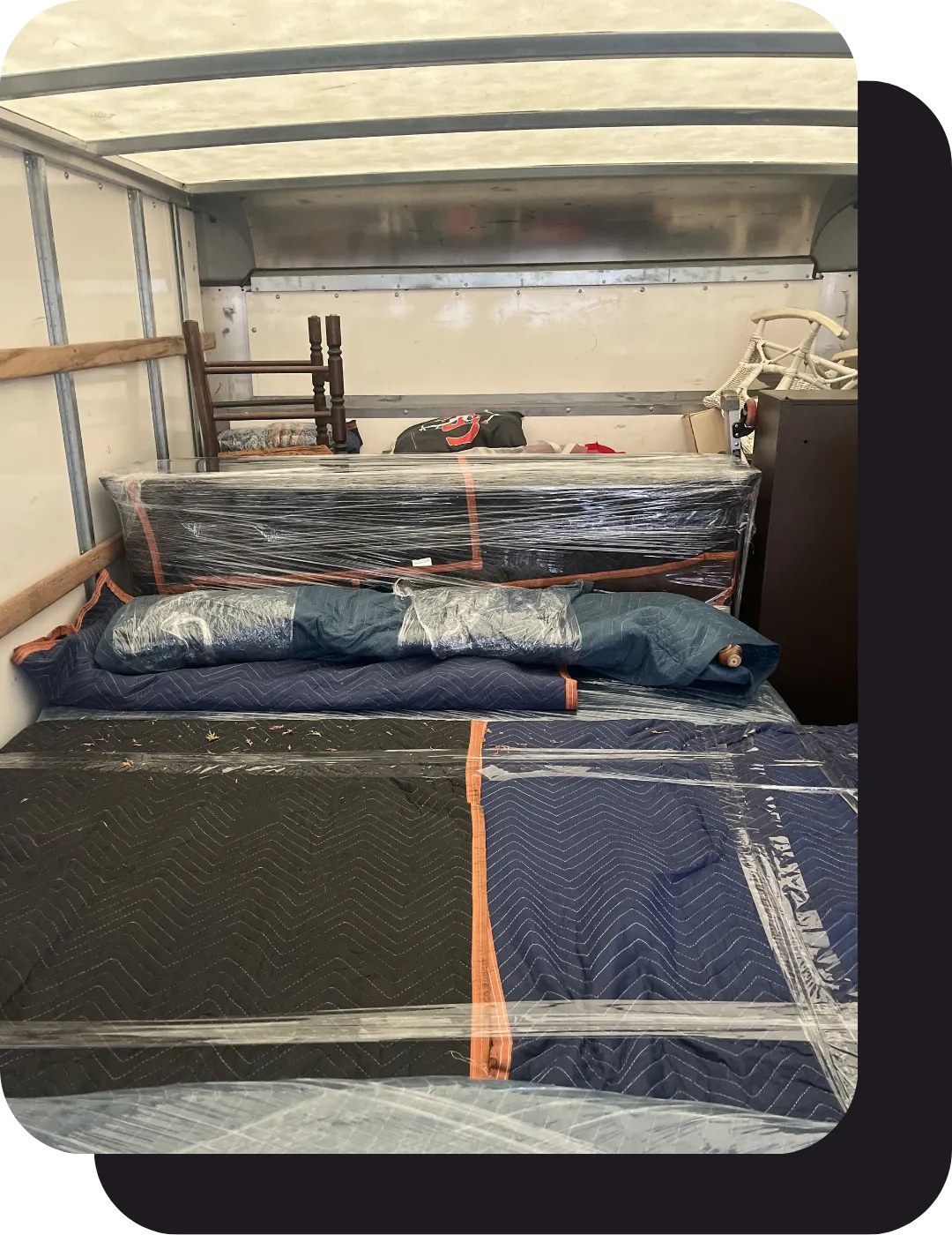 New Jersey apartment movers efficiently loading padded furniture for relocation