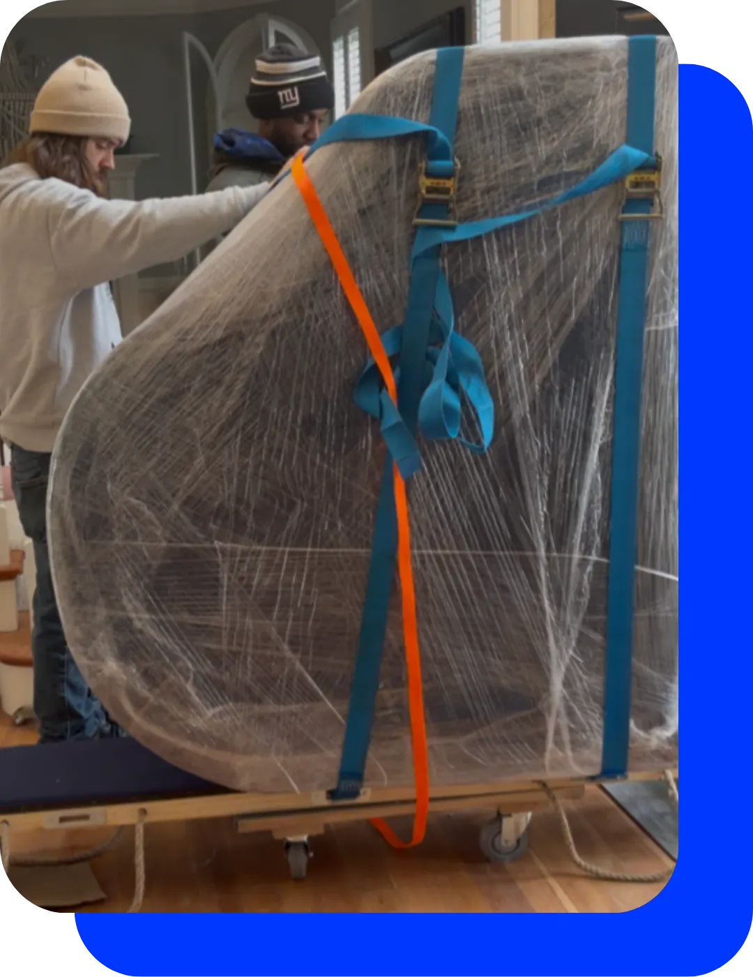 Professional piano moving services using specialized equipment and protective wrapping for safe transportation