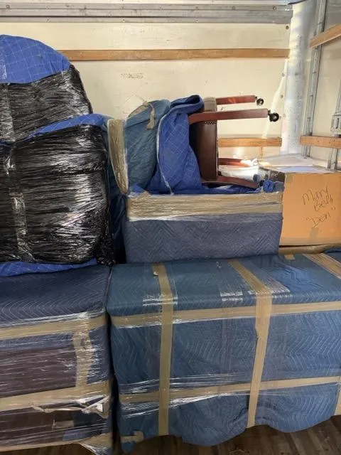 KIMS crew professionally loading and securing furniture and labeled boxes in a moving truck — Mercer County NJ residential move