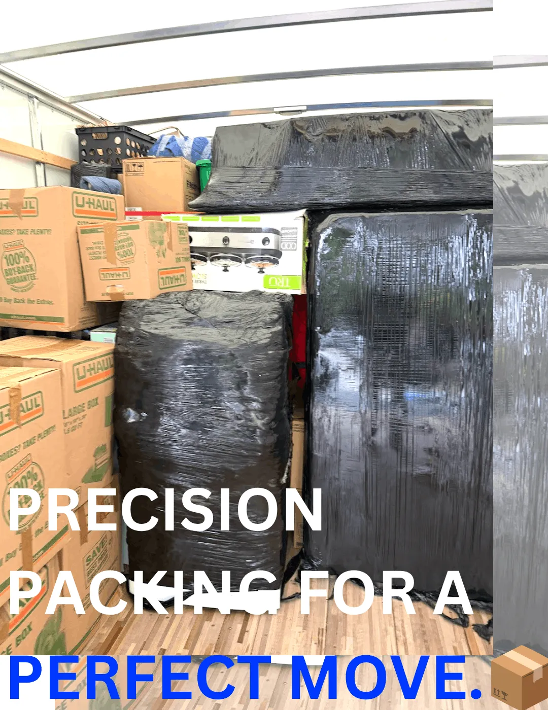 Interior of a moving truck filled with stacked boxes, storage bins, and bags, illustrating the packing process for Keep It Moving Services in New Jersey.