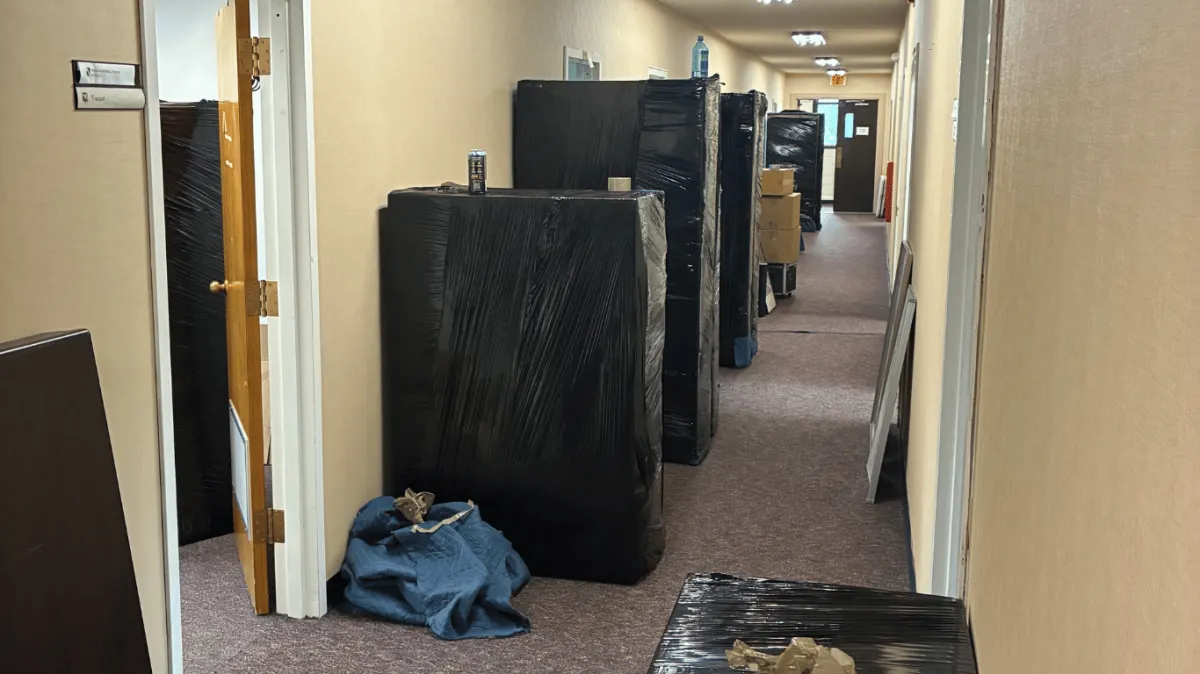 Commercial moving crew unloading boxes from a moving truck during an office and business relocation project in New Jersey
