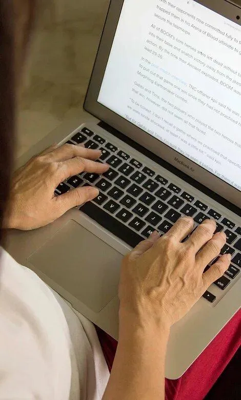 man typing on a computer