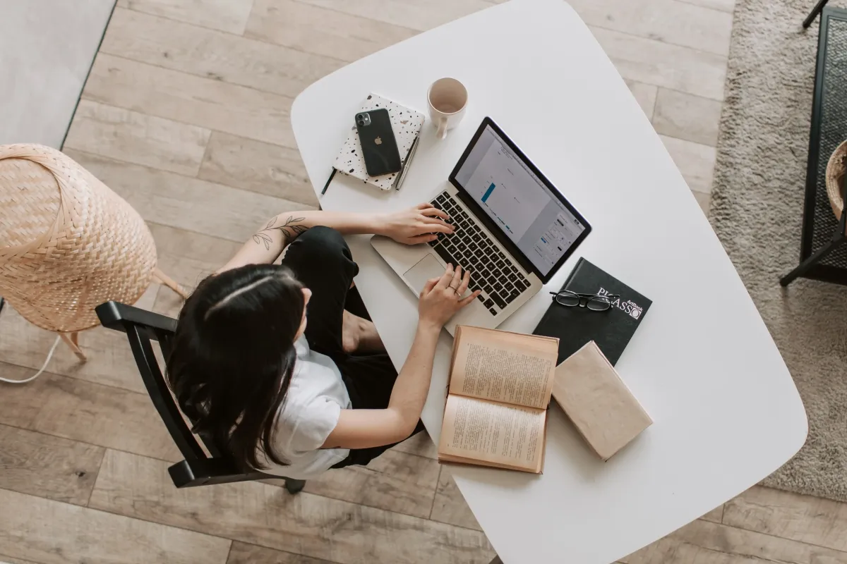 Woman working on laptop at desk