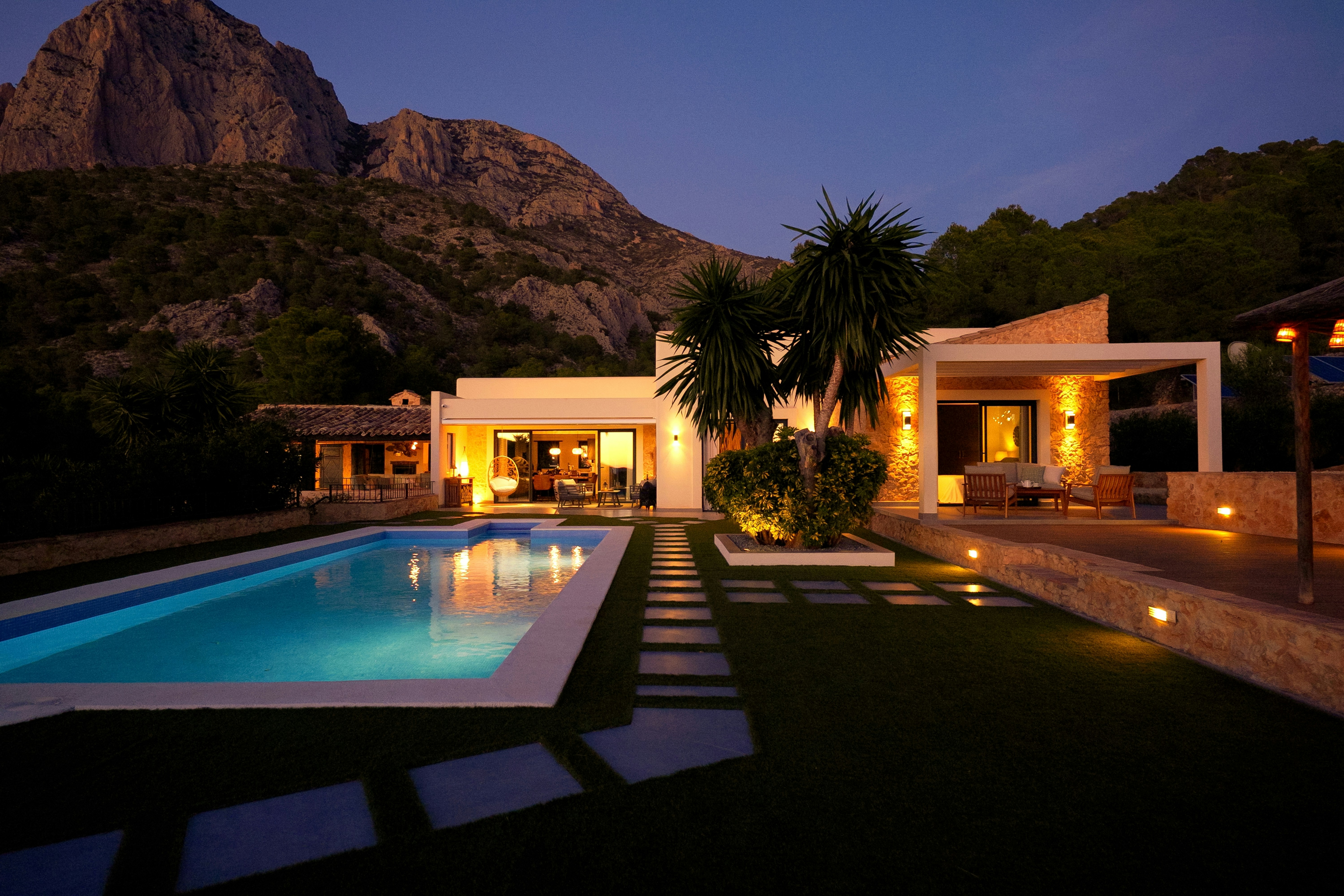 Luxury residential villa exterior at night representing premium architecture firm growth and visibility