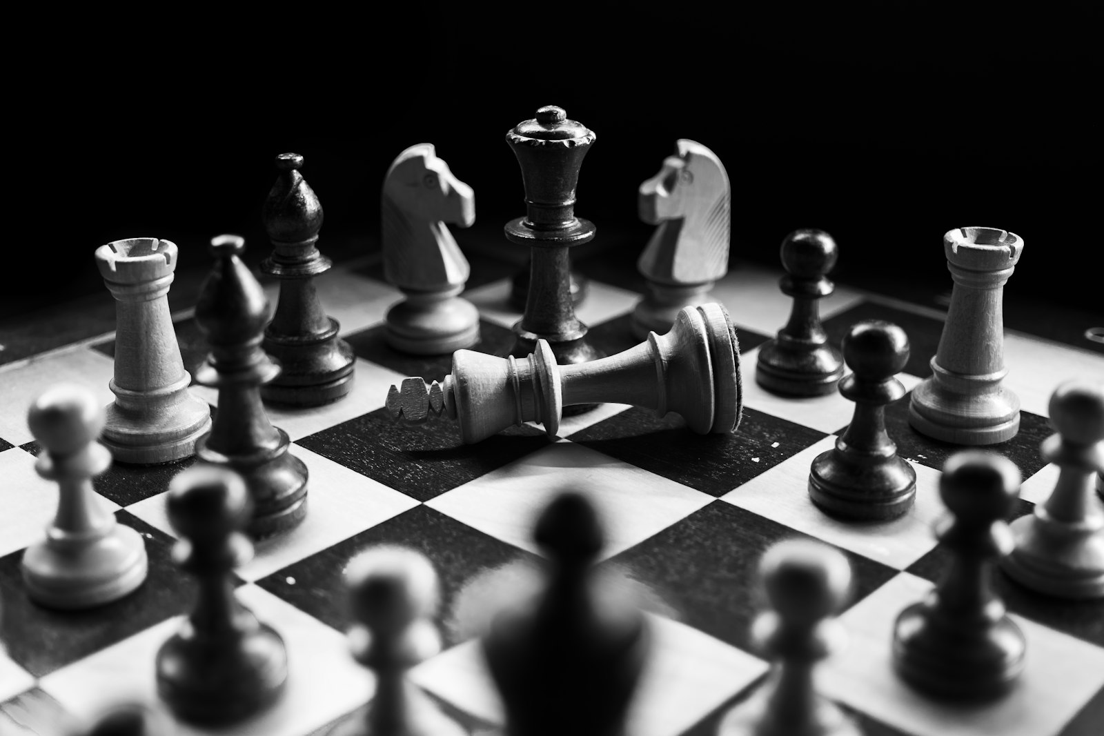 Chess pieces mid-game on a board, symbolizing portfolio strategy