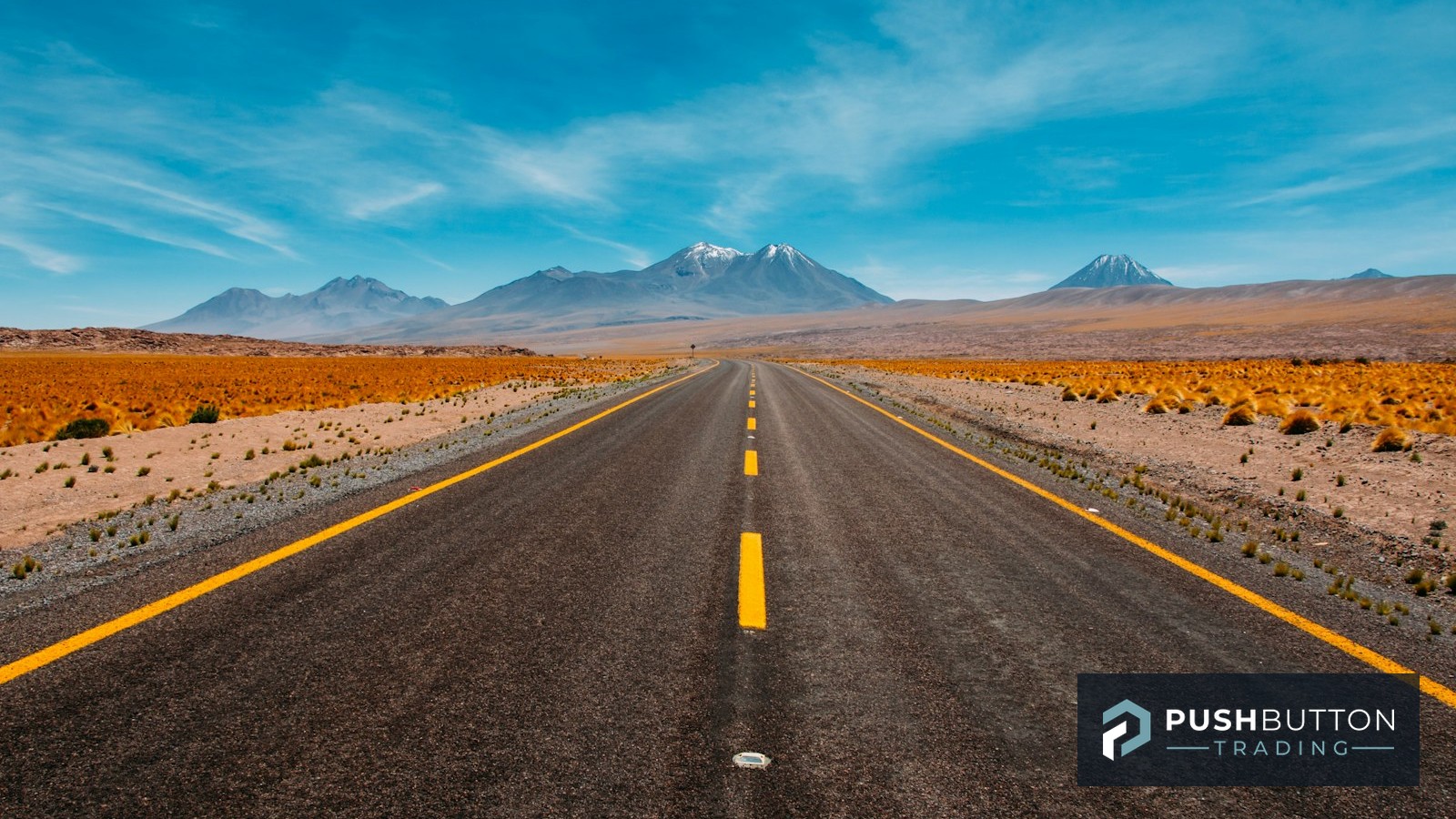 Long straight road stretching toward distant mountains