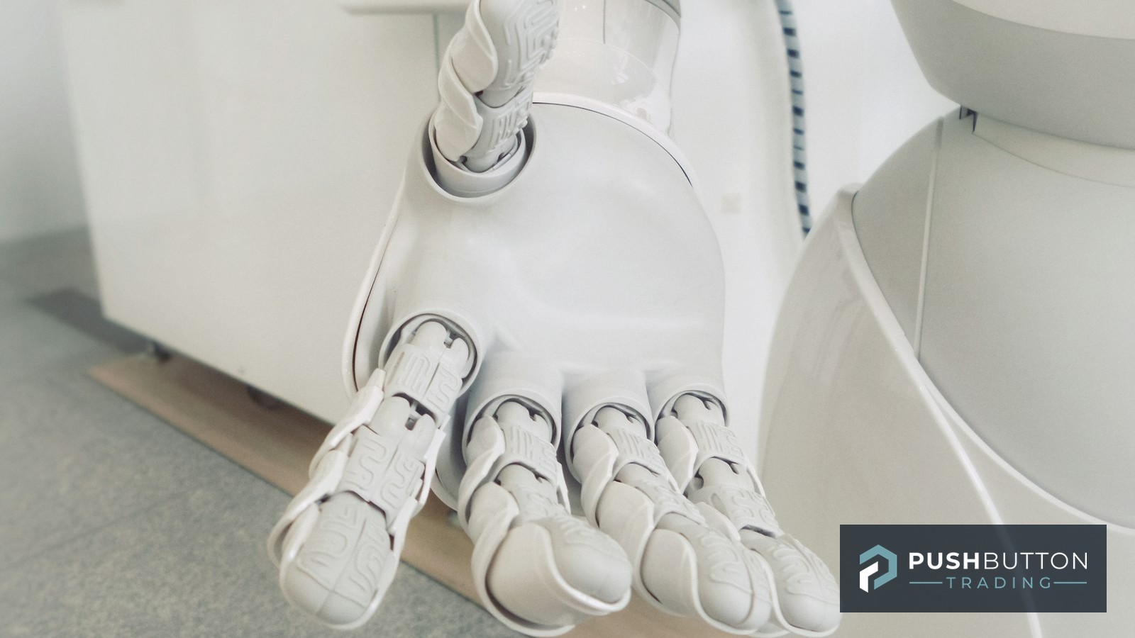 White robot hand reaching forward, symbolizing automated trading