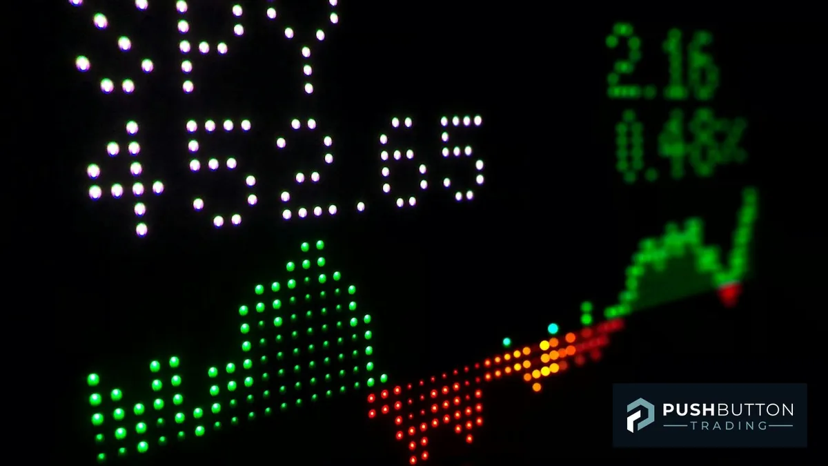 NinjaTrader connection status dashboard showing a live SPY ticker display with Push Button Trading logo overlay
