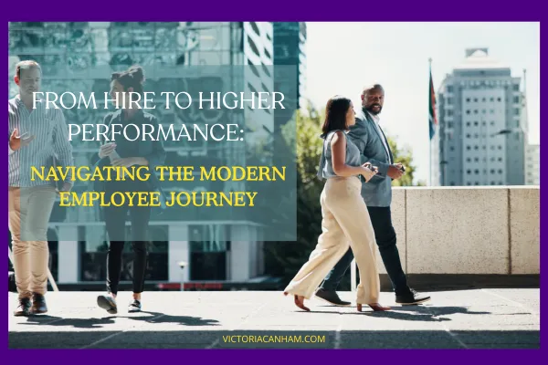 Victoria Canham Consultancy | An image with a purple border. The text FROM HIRE TO HIGHER PERFORMANCE: NAVIGATING THE MODERN EMPLOYEE JOURNEY is overlayed on the image. Two groups of people in business attire walk outside a modern glass office building. In the foreground, a man and a woman walk towards the right. In the background, another man and a woman walk away from the viewer. The website VICTORIACANHAM.COM is at the bottom of the image.