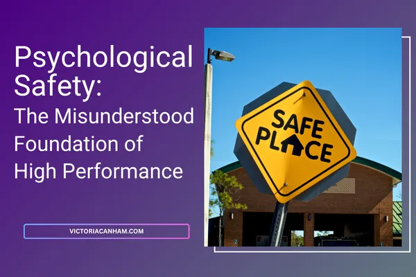 Victoria Canham Consultancy |  A graphic for an article titled 'Psychological Safety: The Misunderstood Foundation of High Performance' from VictoriaCanham.com. The image features a bright yellow, octagonal road sign with the text 'SAFE PLACE' and a small house icon in black, set against a clear blue sky. The sign visually reinforces the concept of safety in the workplace.