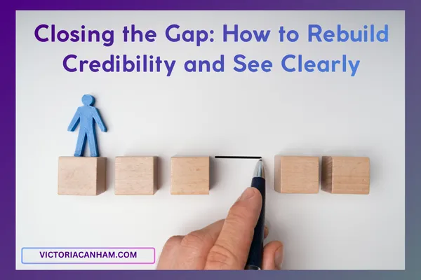 Victoria Canham Consultancy | Conceptual image illustrating a gap being closed. A blue wooden figure representing a leader stands on blocks, separated by a visible space. A hand uses a black pen to draw a line bridging or closing that space, symbolizing the action required to rebuild credibility and trust.