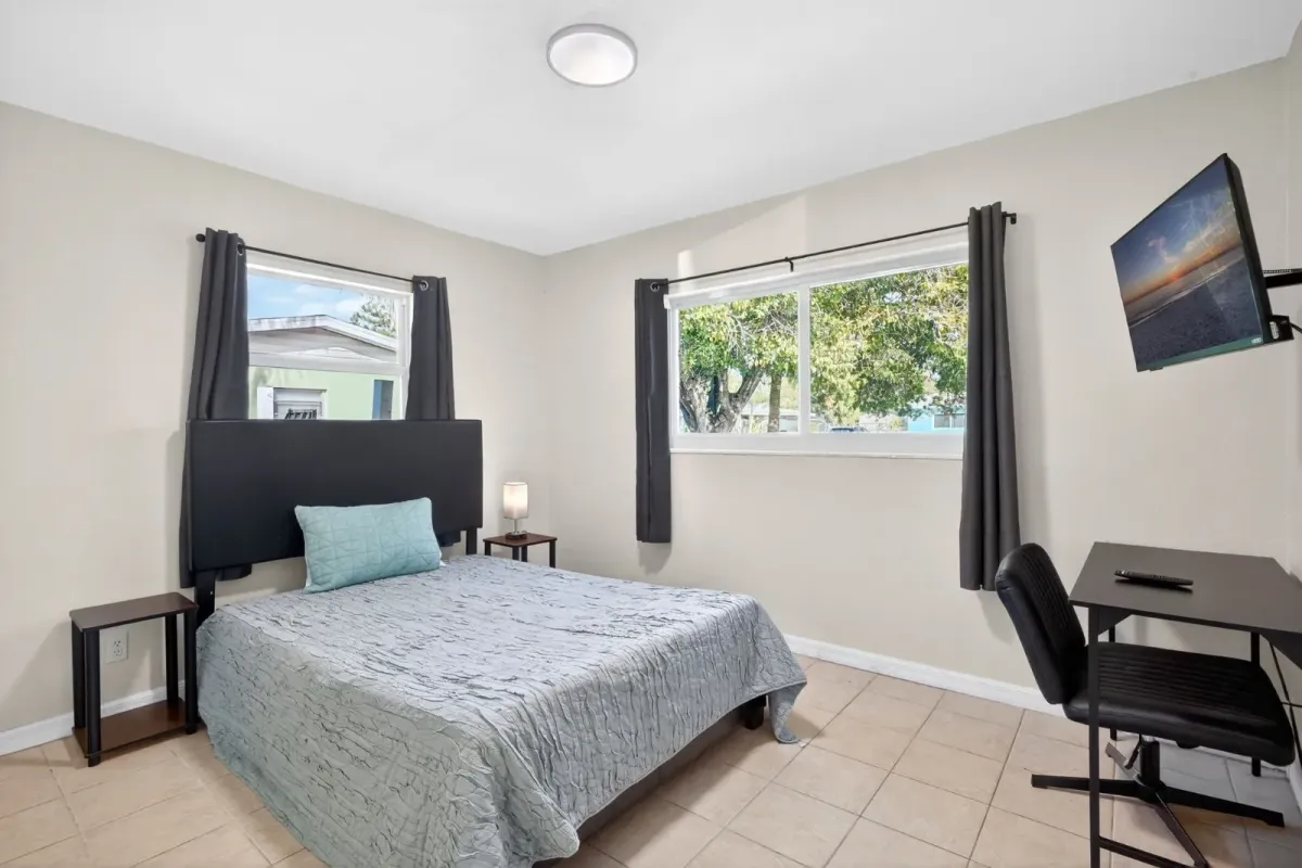 A diverse group of working professionals and individuals in a comfortably furnished living space.