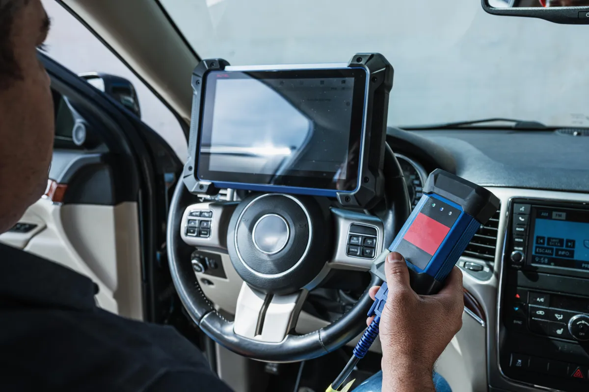 Locksmith programming a car key fob in Venice, FL