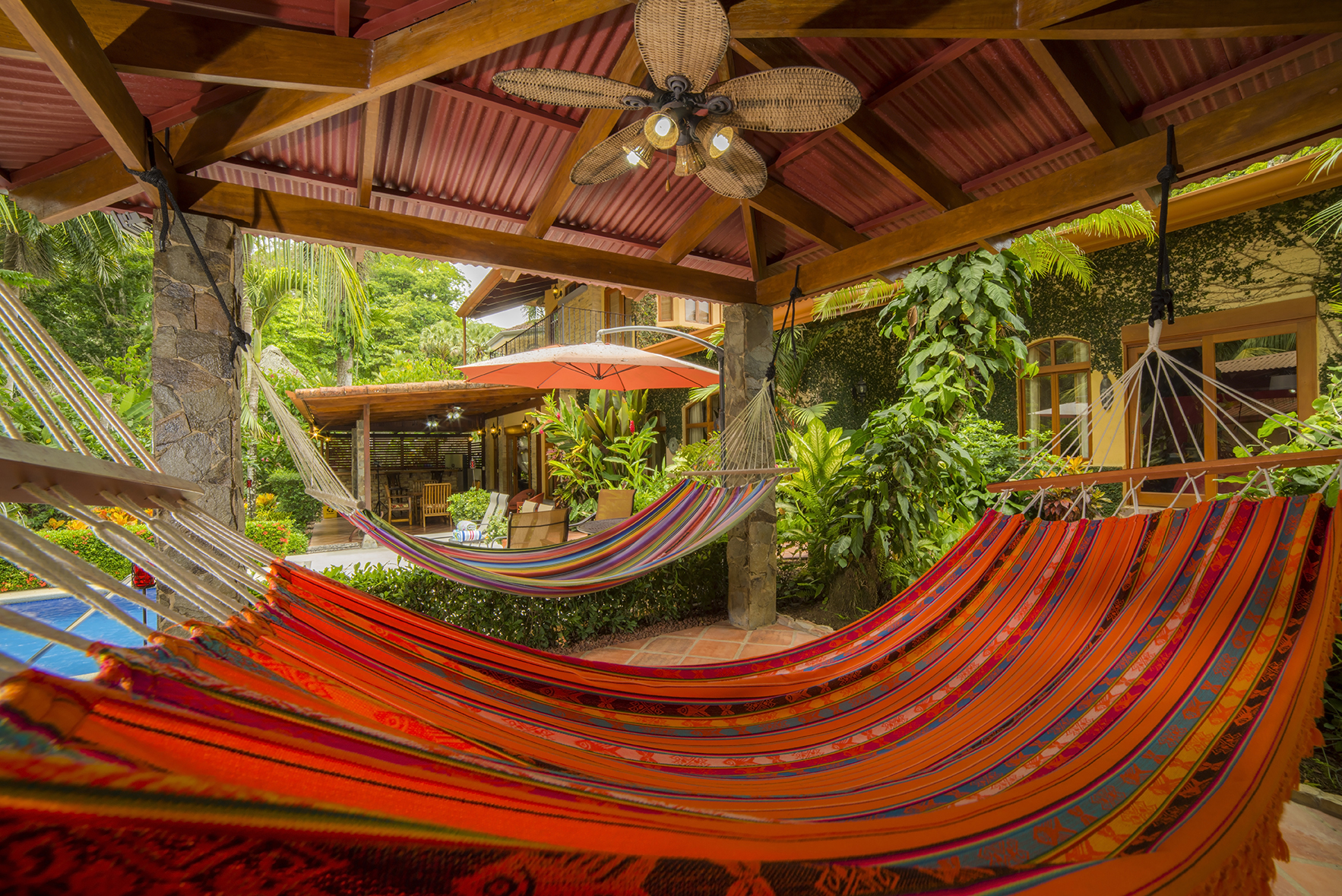 Relax in our cozy hammocks near the pool at Casa Buen Dia