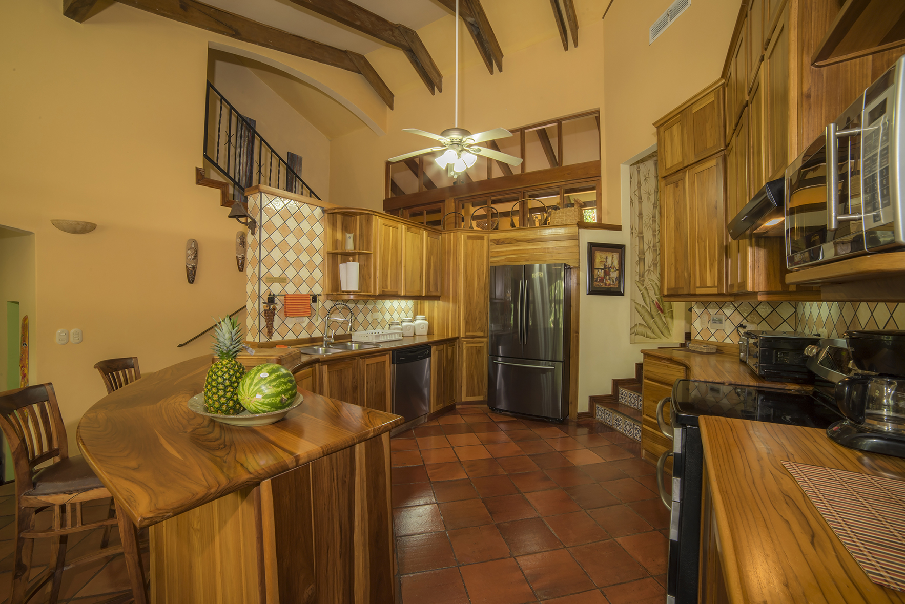 Teak wood cabinets and all-appliance kitchen at Casa Buen Dia