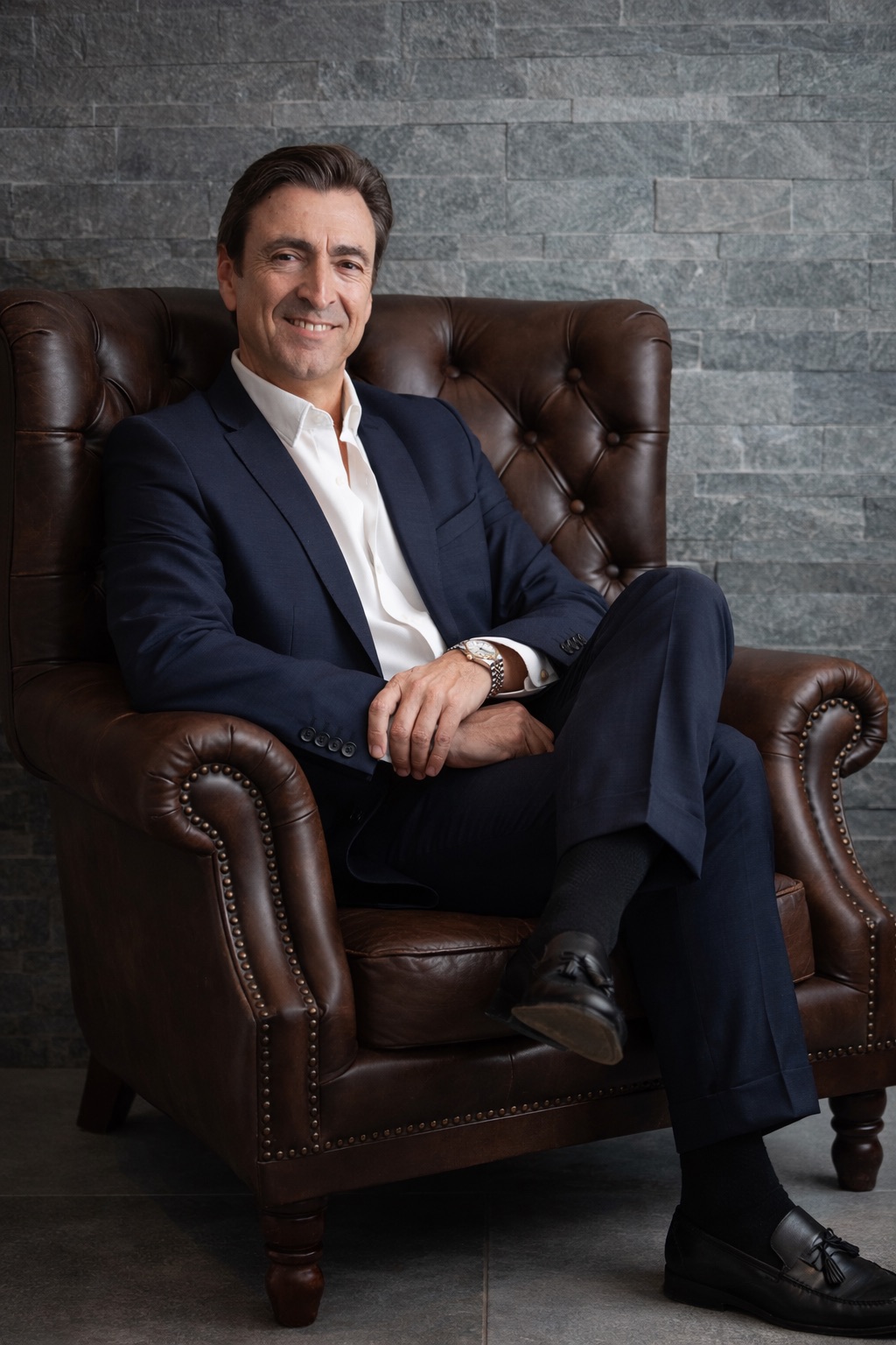 two black suede armchairs during daytime