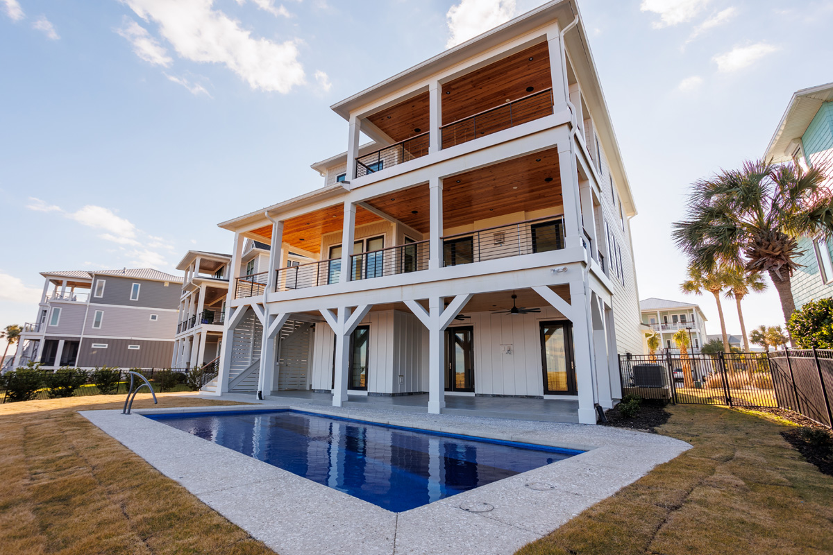 Custom smart home and multi-zone outdoor audio integration by AcoustiCreations at a luxury three-story oceanfront residence in Carolina Beach, NC