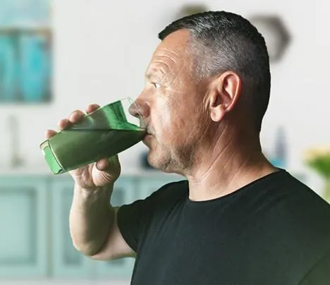 person taking green glucose
