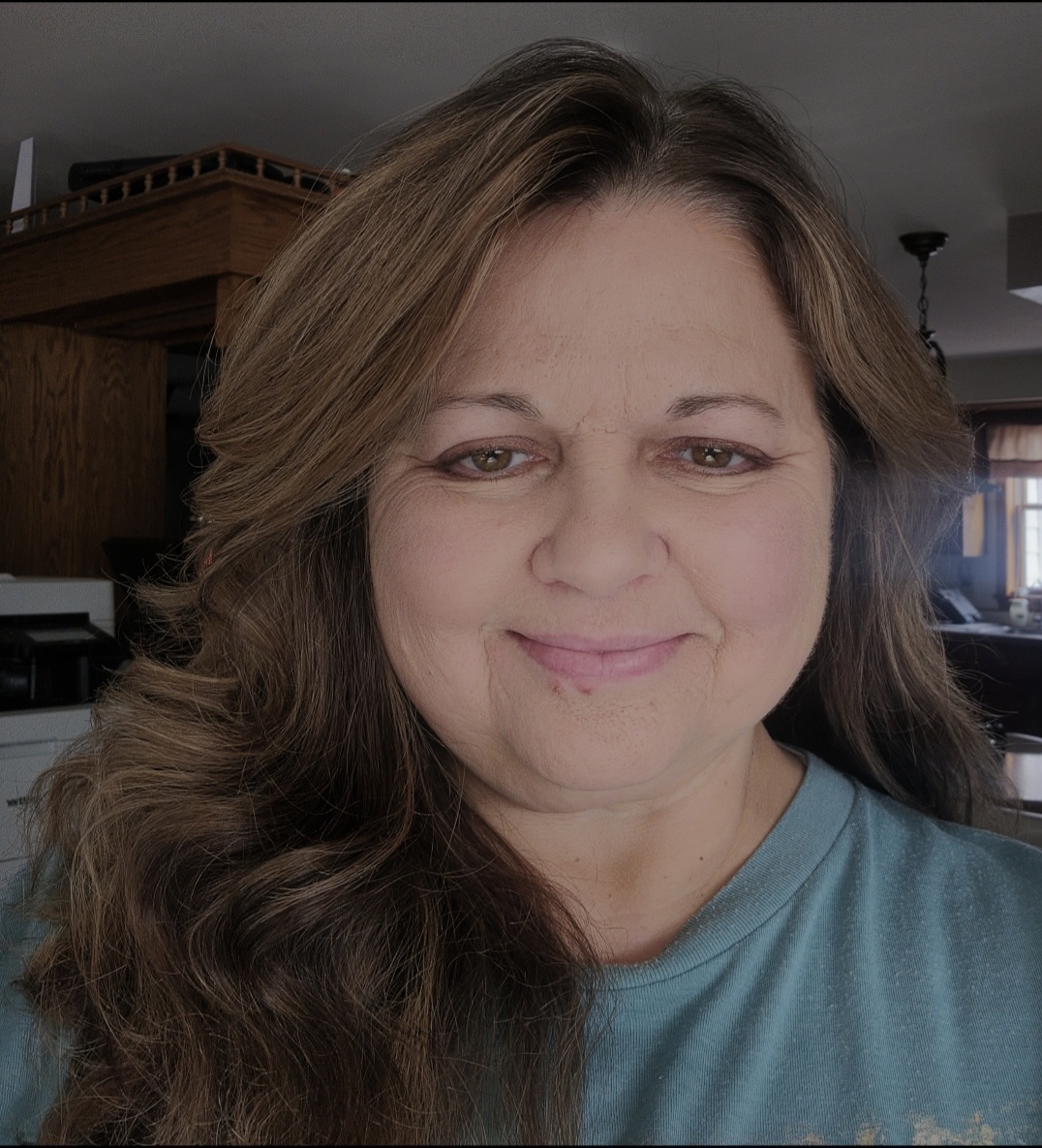 short-haired black cat besides brown wooden table
