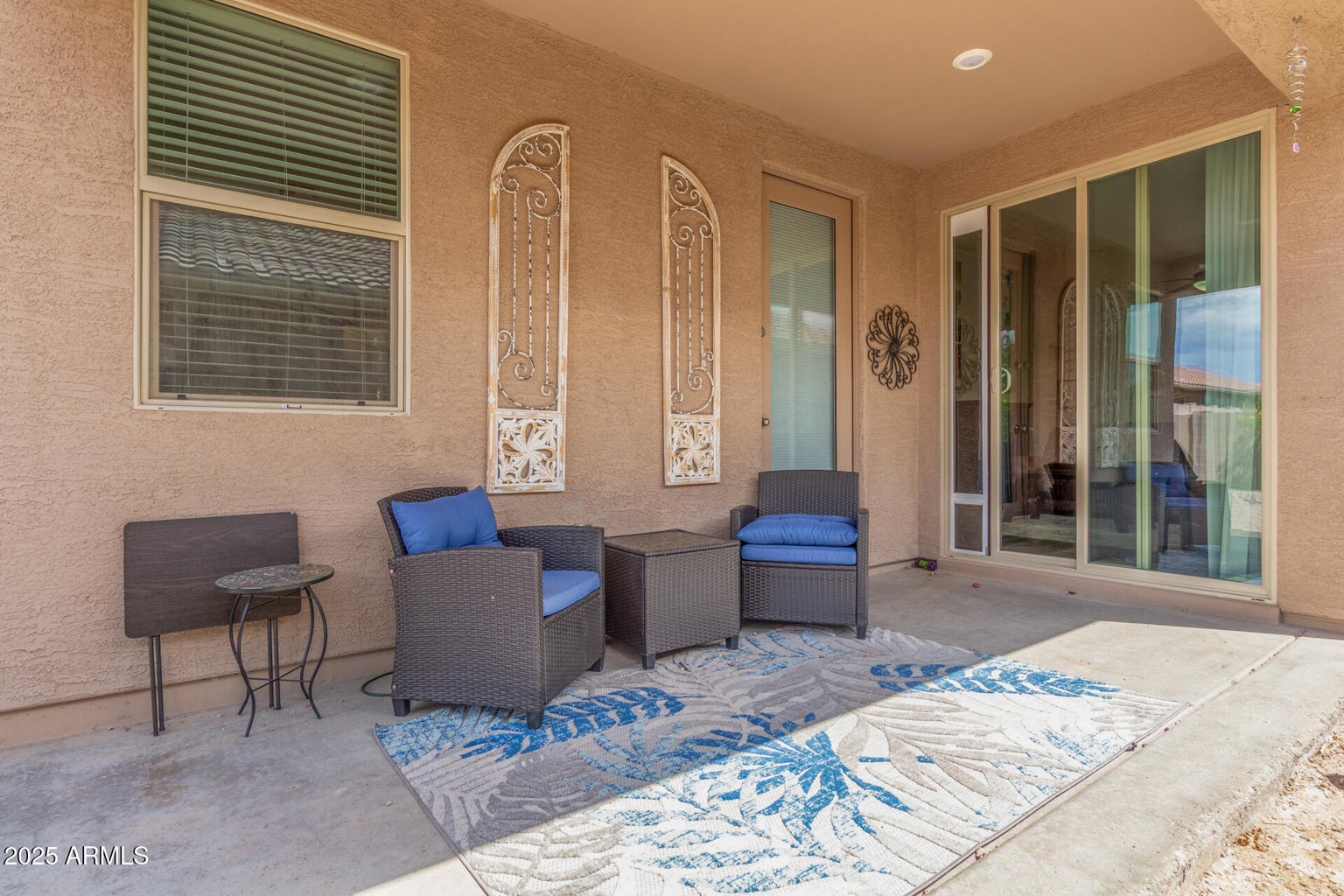 patio with chairs and rug