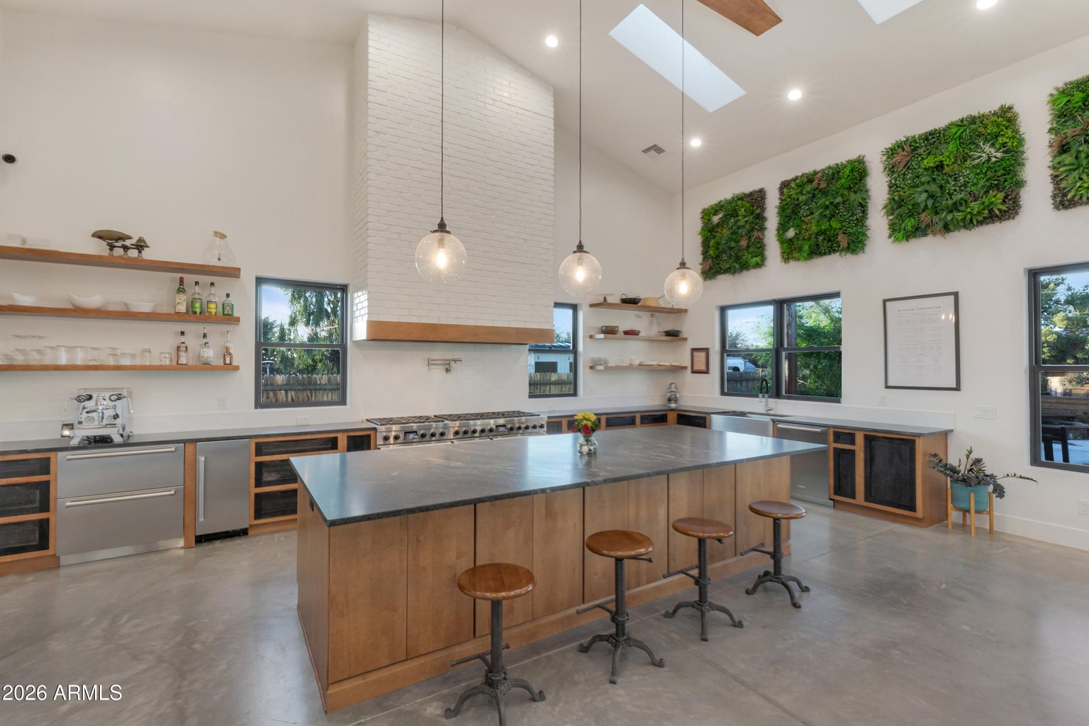 large kitchen with windows and an island 
